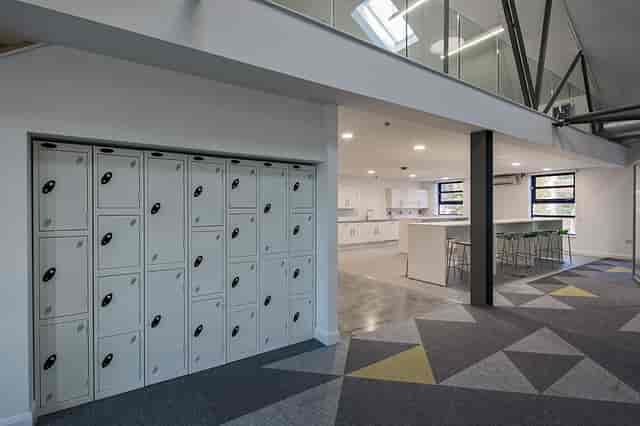 Modern open space with kitchenette for meetings and events at Ada National College.