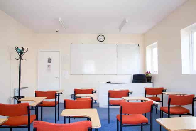 Meeting Room 101 with orange chairs, ideal for events and meetings in North London.