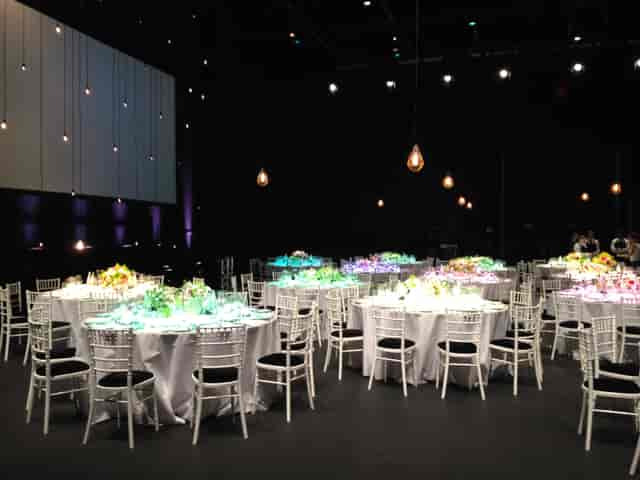 Sadler's Wells Theatre event space with elegant tables, floral centerpieces for weddings.