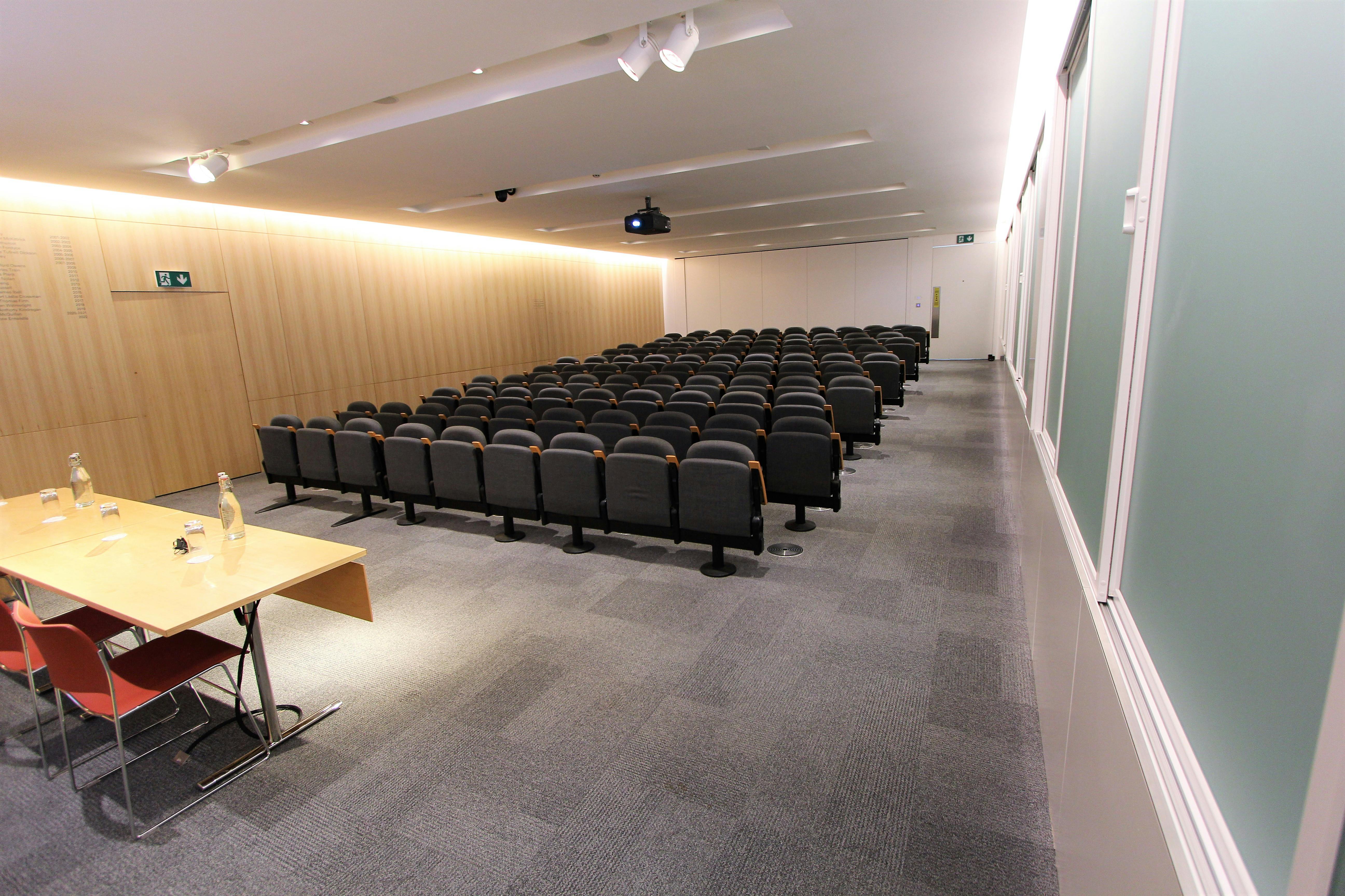 Modern conference room at Auditorium, spacious seating for professional events and meetings.