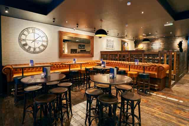 Stylish venue with rustic decor for casual meetings and events at The Stable, Running Horse.