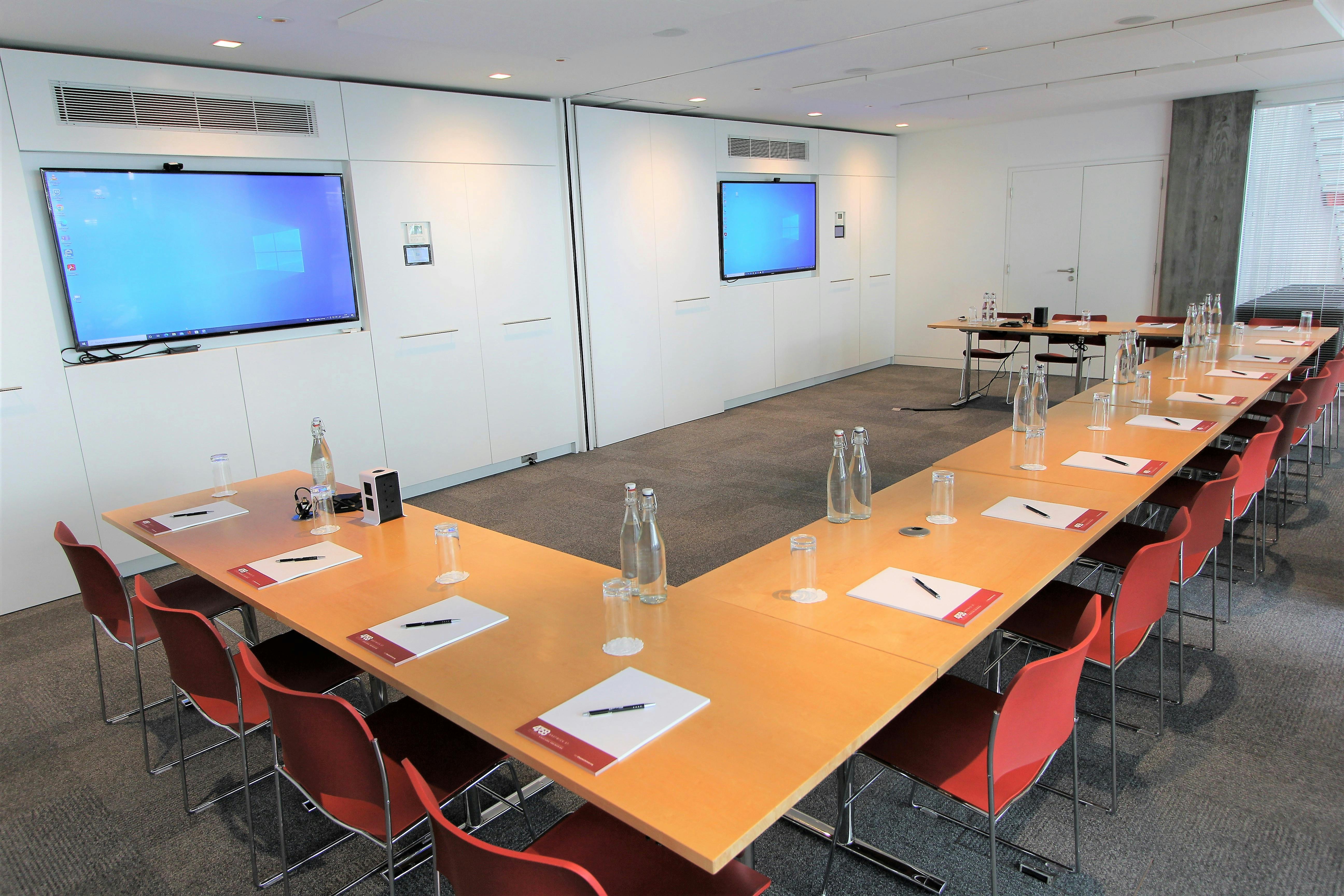 Belgrave Suite meeting room with U-shaped table, ideal for professional gatherings.