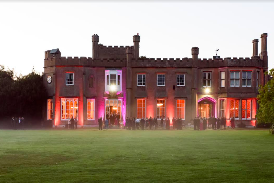 Stunning Nonsuch Mansion venue with castle-like exterior, ideal for events and receptions. - Banner