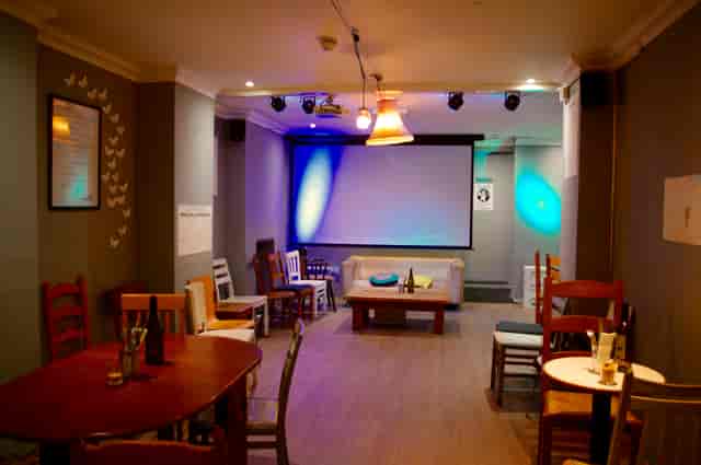 Versatile event space in The Canvas with subdued lighting, ideal for meetings and gatherings.