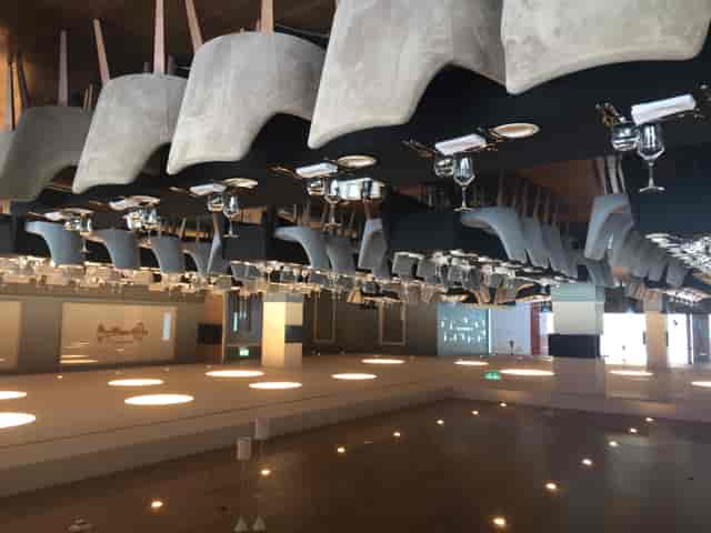Elegant event space at Liverpool FC with polished tables for corporate meetings.