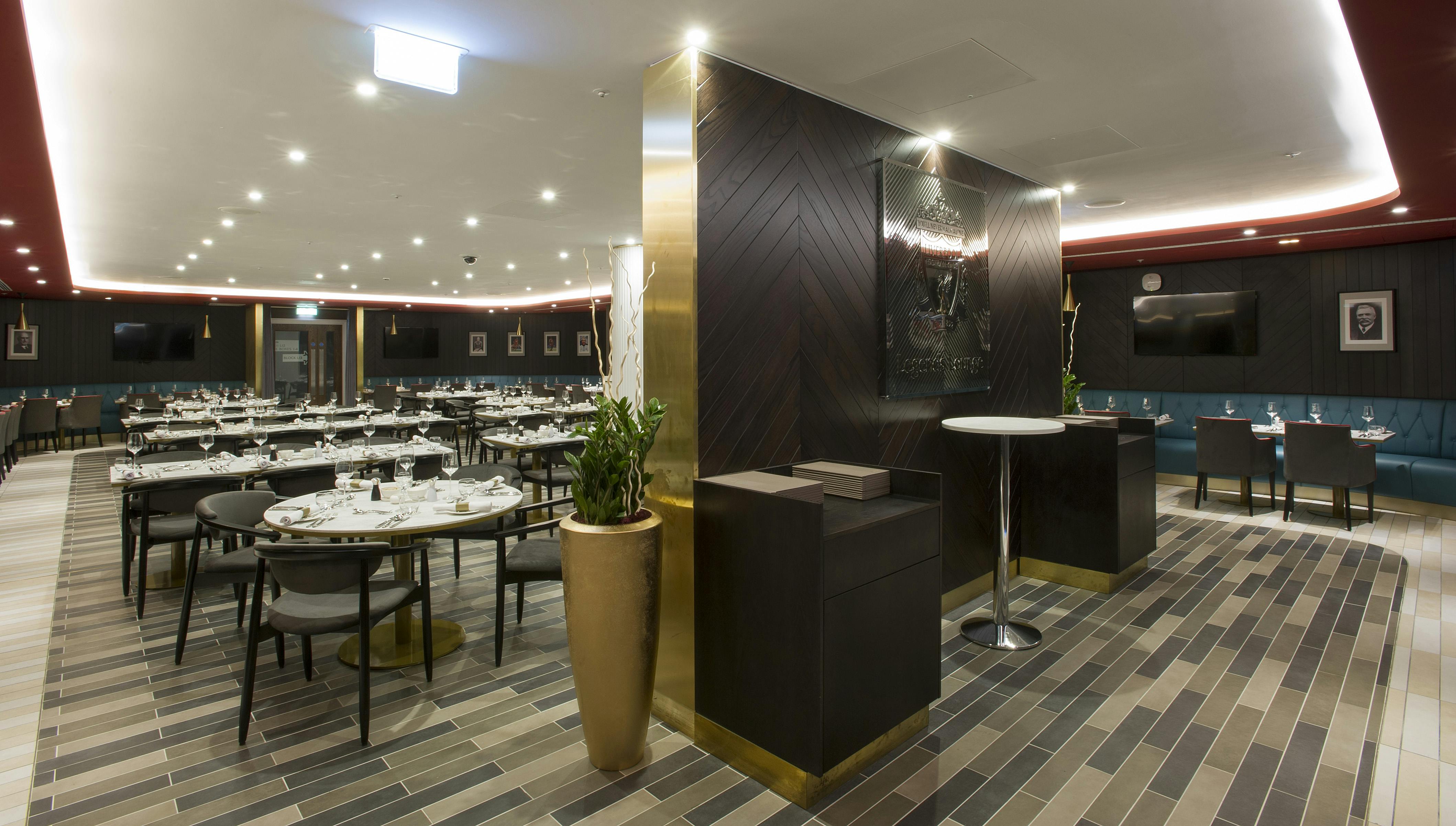 Legends Lounge at Liverpool FC: modern dining space for events with sleek tables and bar.