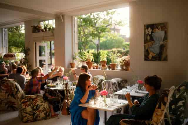 Vibrant café bar with cozy seating, ideal for networking events and informal meetings.