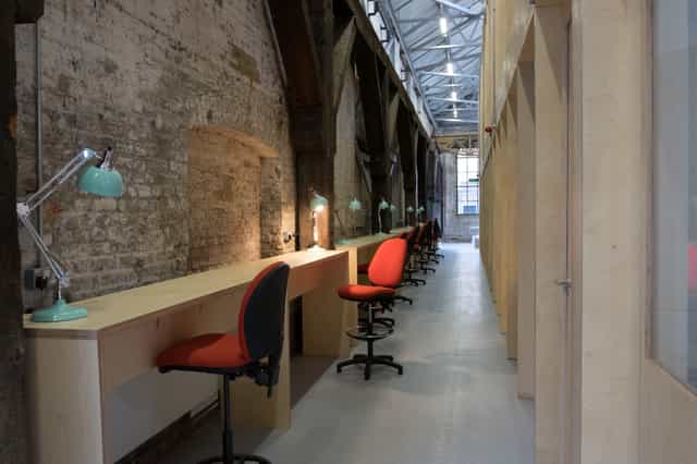 Multipurpose meeting rooms in Craft Central with ergonomic workstations for creative events.
