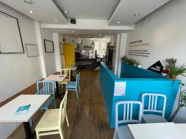 Modern cafe in The Canvas with cozy seating for informal meetings and events.