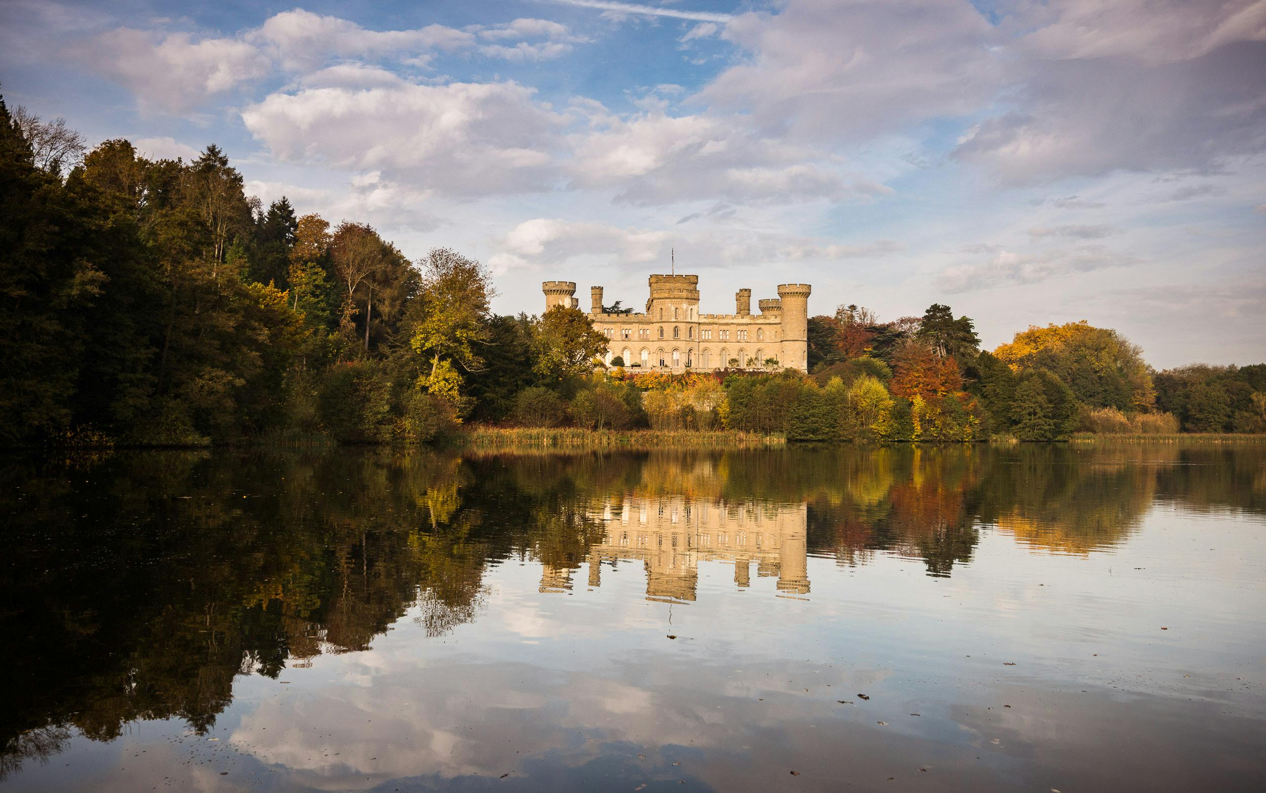 Eastnor Castle venue with autumn colors, perfect for corporate retreats and weddings.