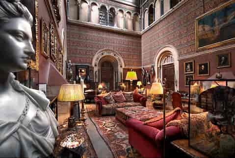 Elegant event space at Eastnor Castle with plush seating for private receptions.