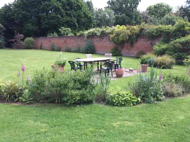Serene garden at Bell House, perfect for meetings and events with lush greenery.