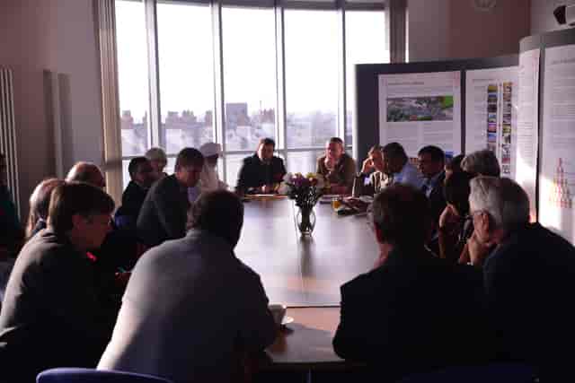 Nishkam Centre seminar room boardroom meeting with silhouette issues due to window backlighting.
