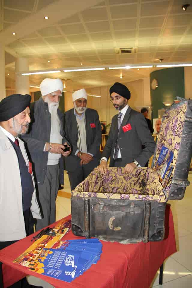 Group discussion at Nishkam Centre, showcasing traditional attire during a cultural event.