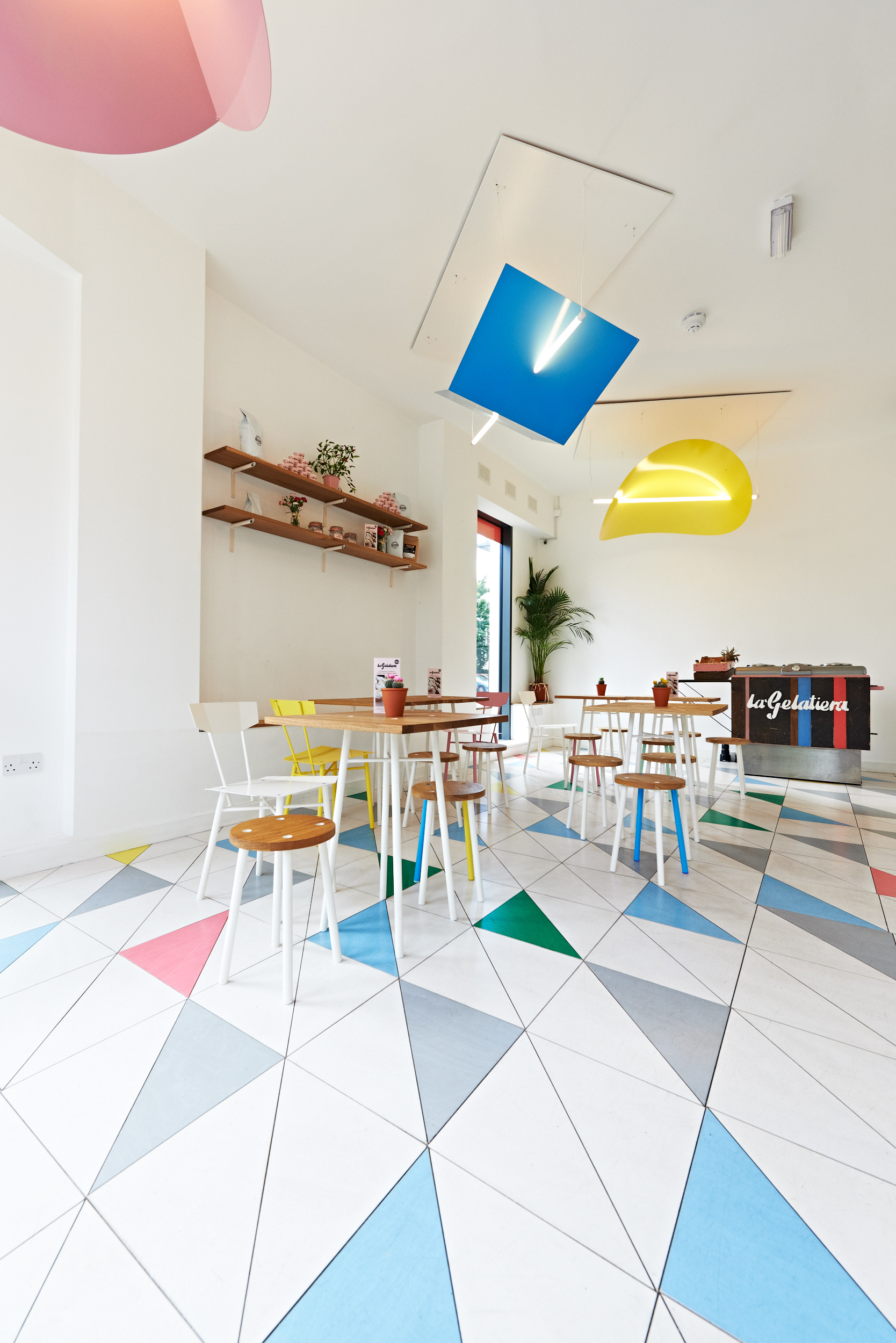 Vibrant gelato cafe with colorful tiles, ideal for casual meetings and networking events. - Banner