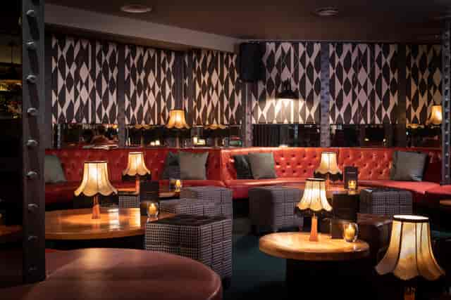 Stylish lounge at All Star Lanes Holborn for intimate gatherings and networking events.