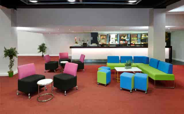 Chablis Suite lounge at Novotel London West, vibrant seating for networking events.
