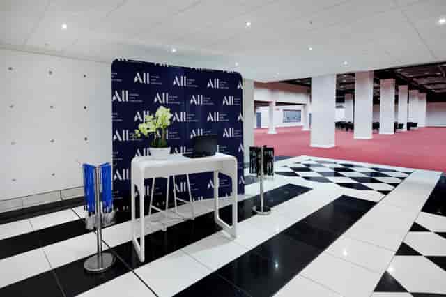 Chablis Suite registration area with elegant decor for professional events in London.