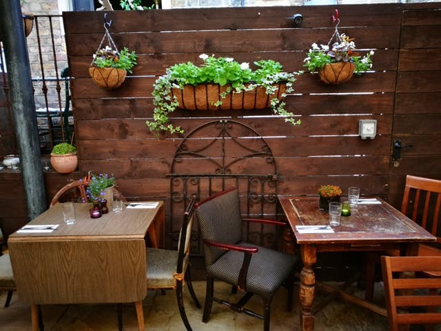 Intimate dining space at Rullo's with rustic decor, ideal for casual meetings and networking.