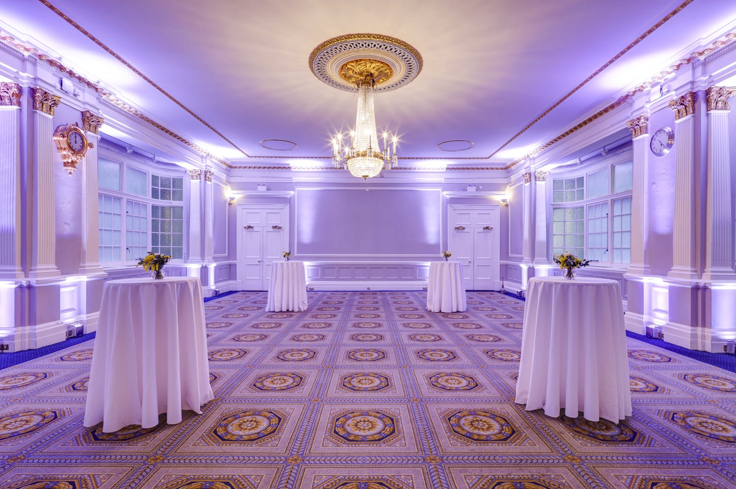 Elegant event space at Burton, 116 Pall Mall, featuring soft purple lighting and luxury ambiance.