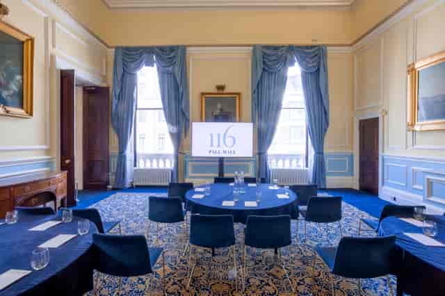 St James boardroom at 116 Pall Mall with blue branding for corporate meetings and conferences.