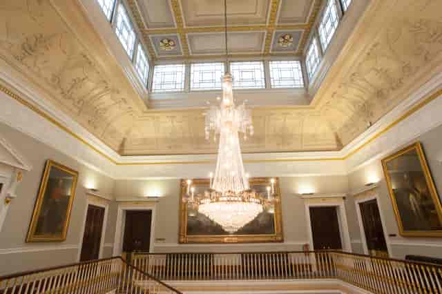 Elegant St James Rooms with grand chandelier, perfect for weddings and corporate events.