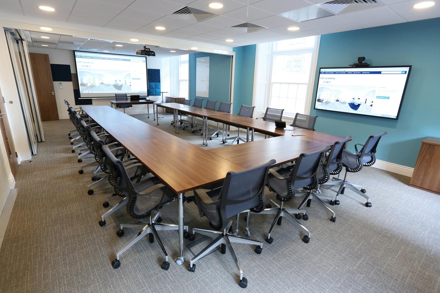 Modern conference room at IoD Academy with ergonomic chairs for collaborative meetings.