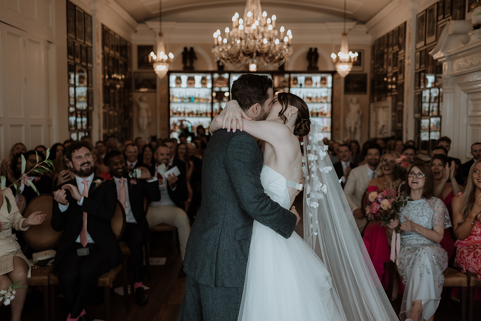 Intimate wedding ceremony in Nelson Room, Trafalgar Tavern, capturing couple's first kiss. - Banner