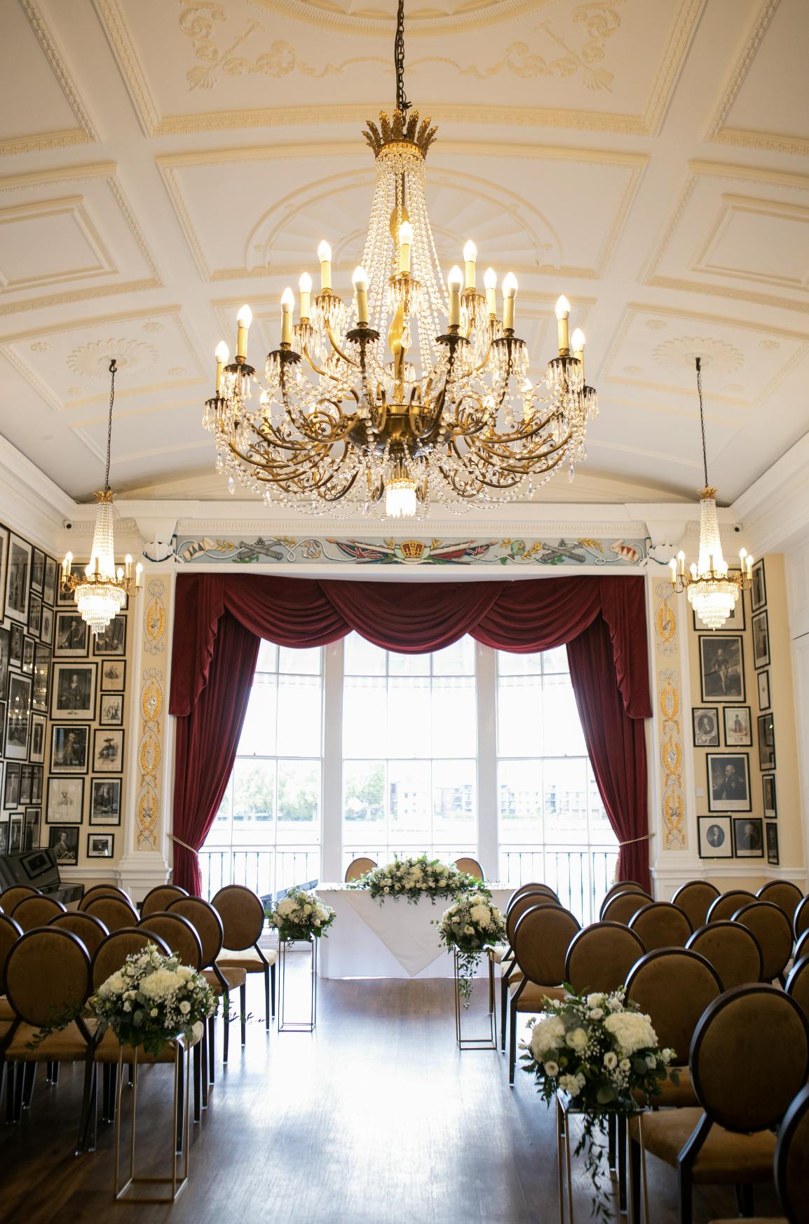 Elegant Nelson Room at Trafalgar Tavern with chandelier, ideal for events and gatherings.