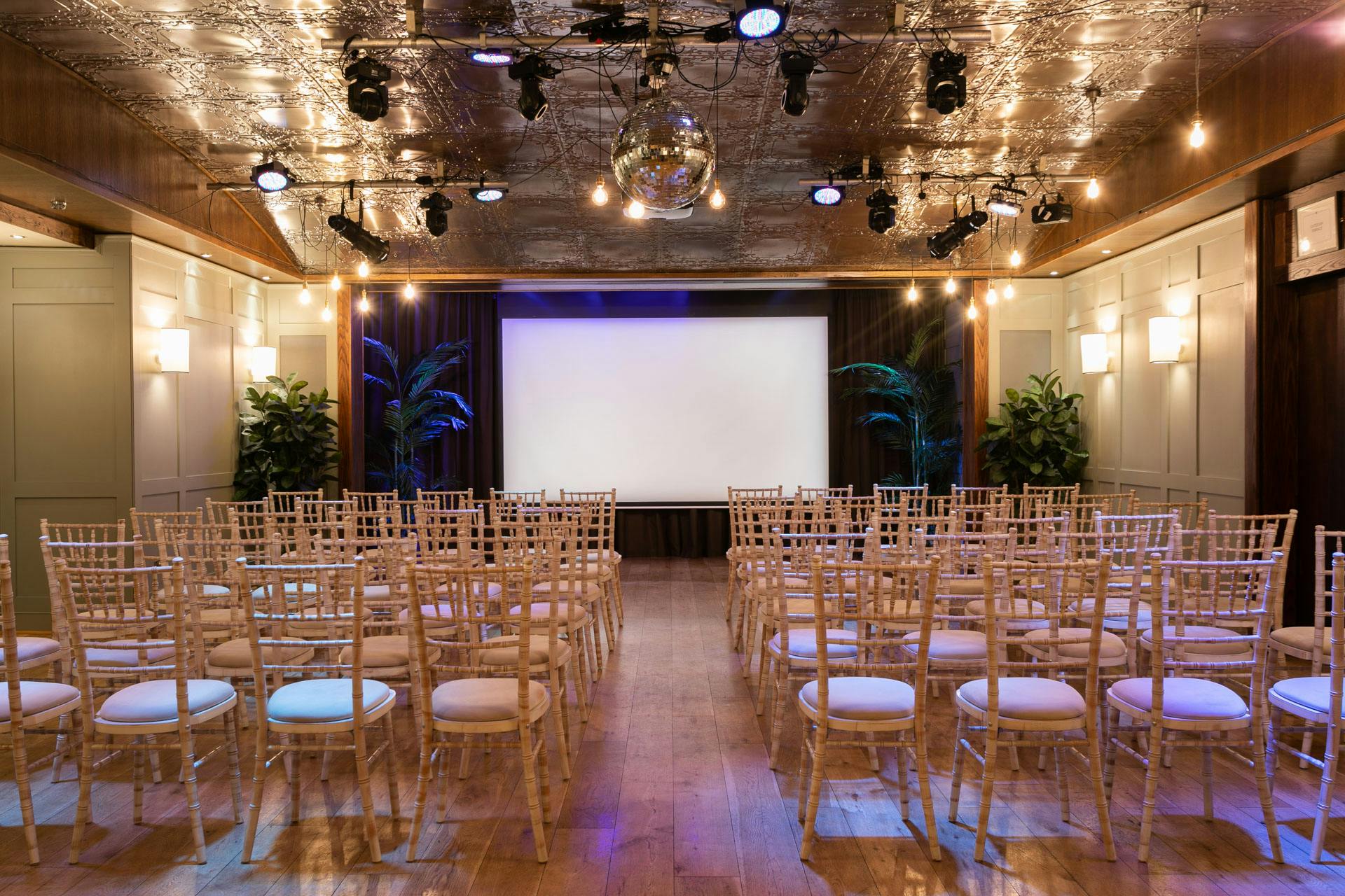 Green Room at Century Club with chiavari chairs for presentations and events.