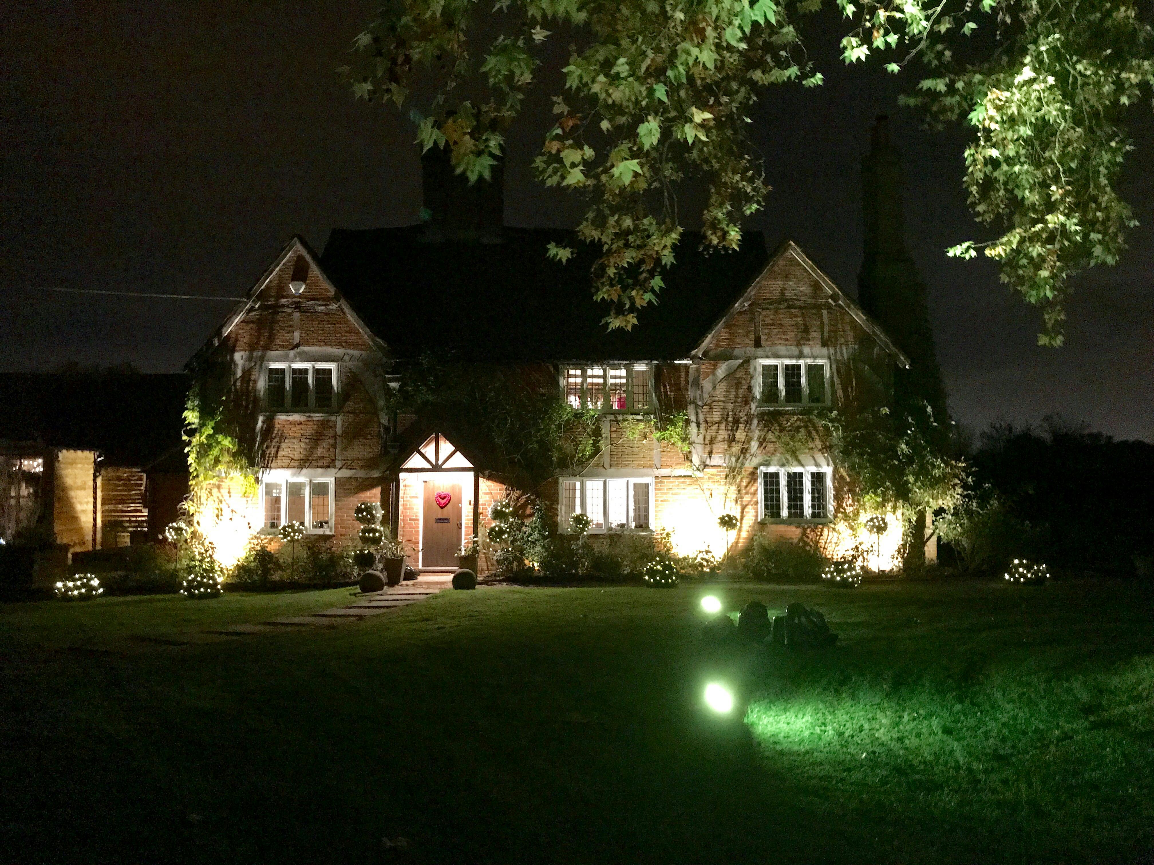 Illuminated St Michaels Grange Barn venue, ideal for weddings and corporate events.