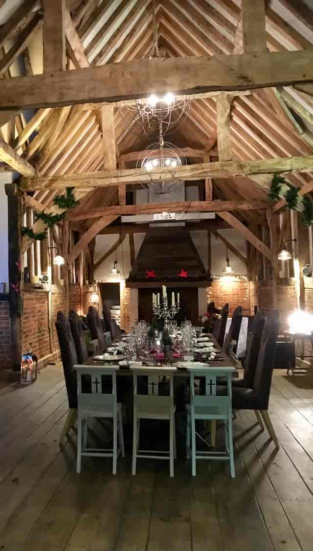 Elegant dining table in rustic St Michaels Grange Barn for gala dinner or holiday event.