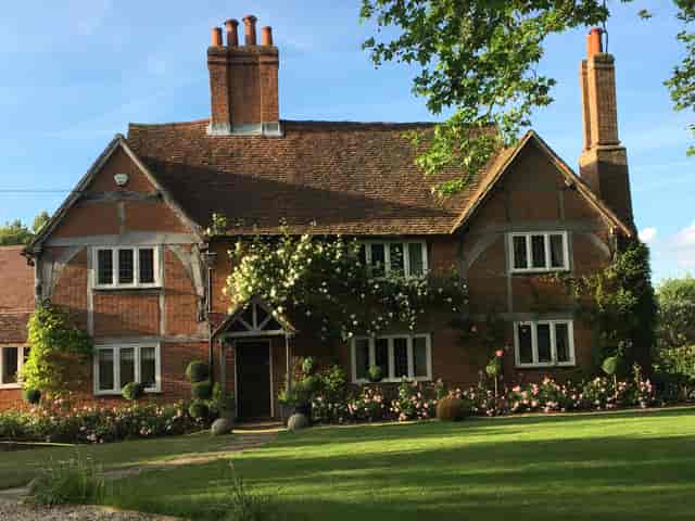 Charming St Michaels Grange Barn venue for weddings and outdoor events, featuring lush landscaping.