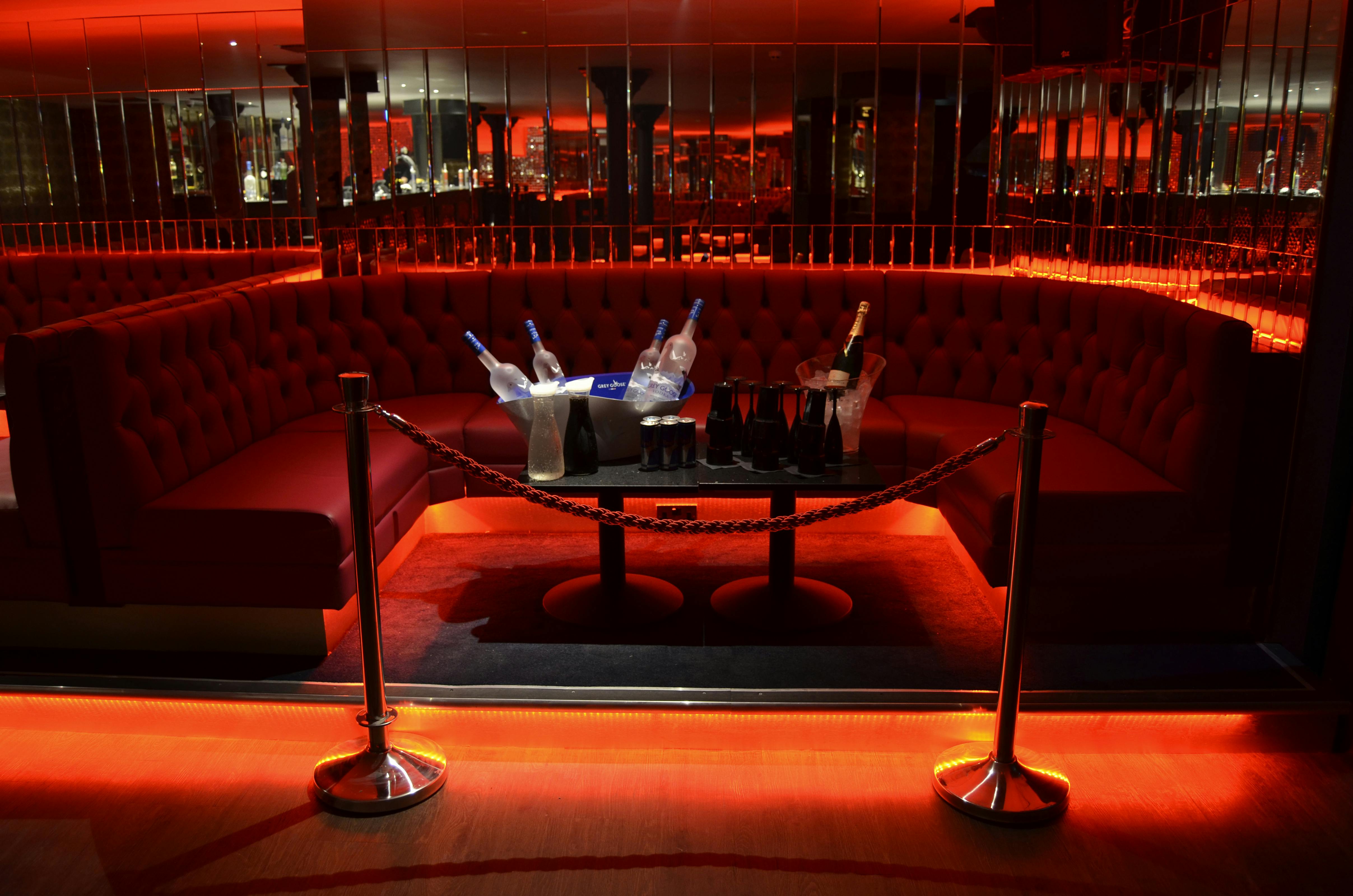 Upscale lounge in Sugar Hut Liverpool with plush red seating for exclusive events.