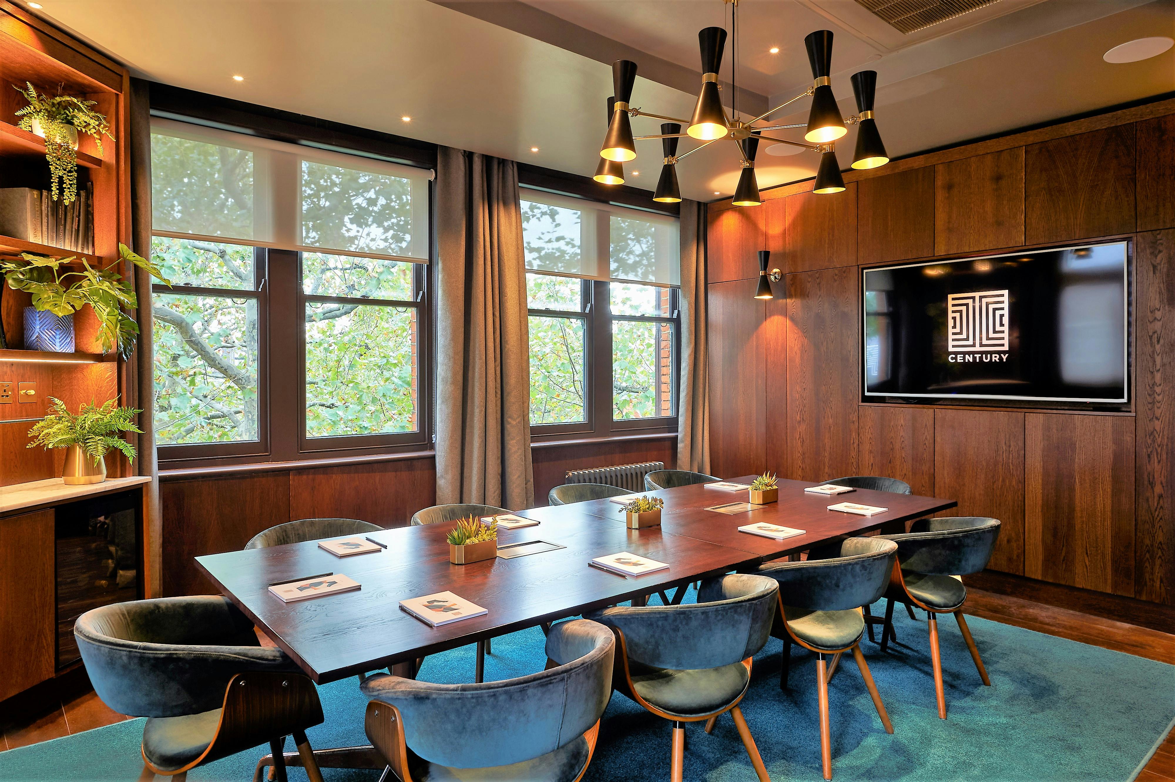 Modern meeting room at The Compton, featuring sleek wooden walls for creative collaboration.