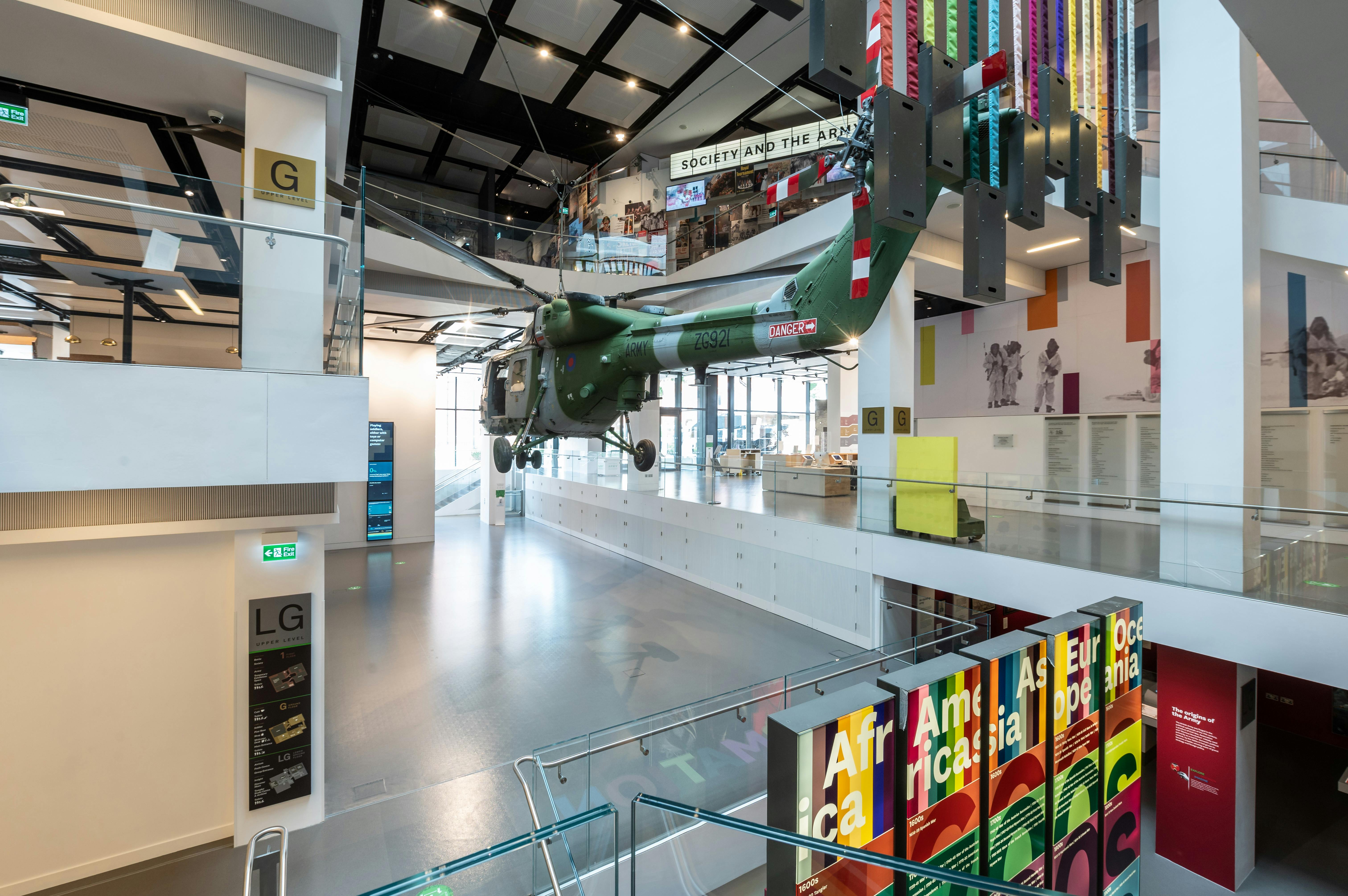 Atrium in National Army Museum with suspended helicopter, ideal for corporate events and exhibitions.