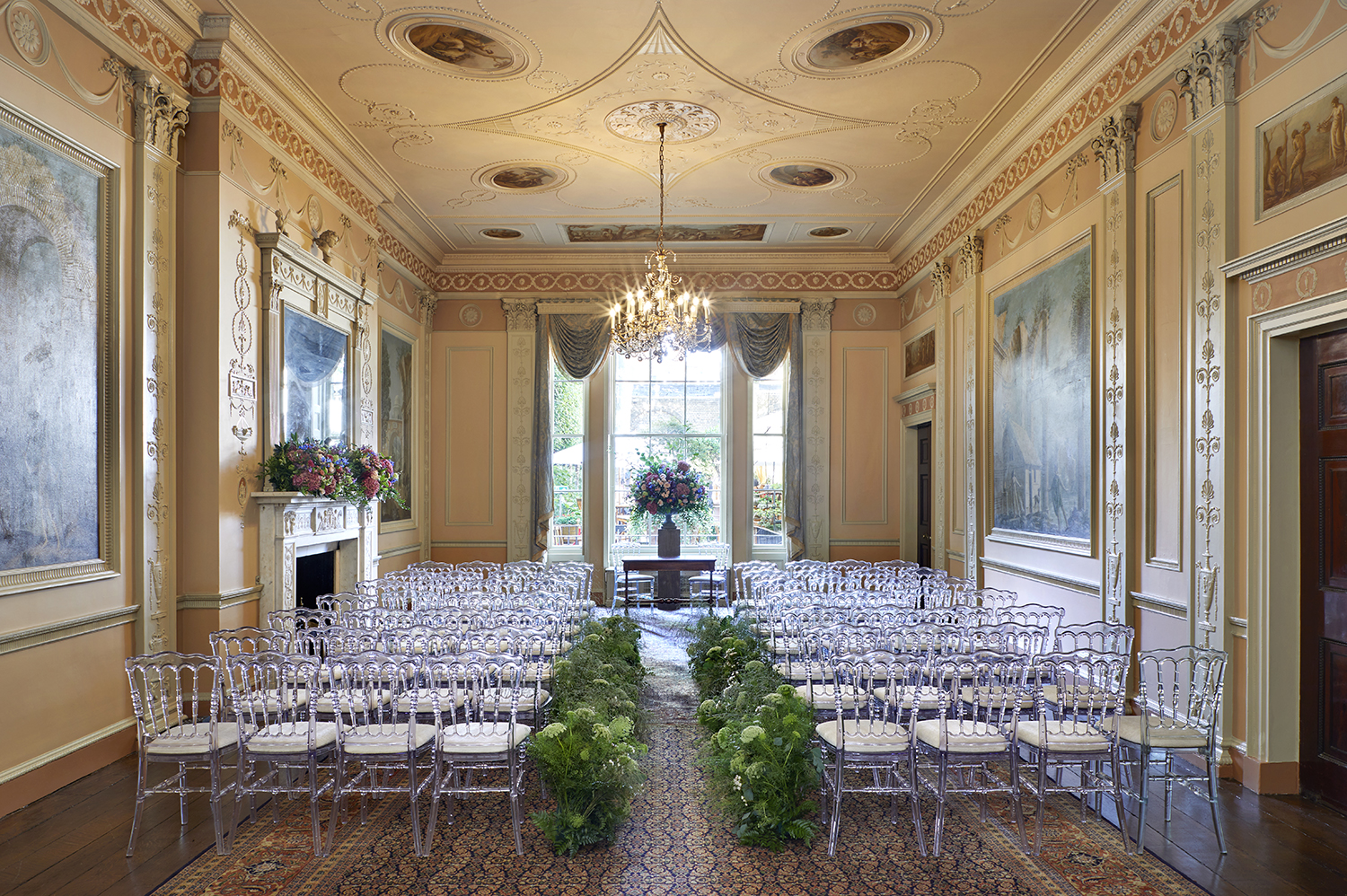 Elegant event space with chiavari chairs and floral centerpiece for upscale gatherings.