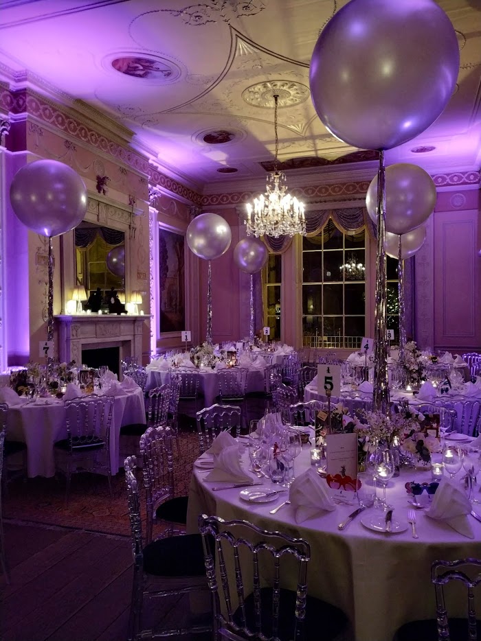 Elegant event space with tall balloons, perfect for weddings and corporate gatherings. - Banner
