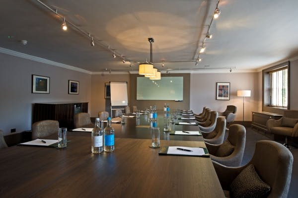 Boardroom at Home House with wooden table, ideal for meetings and workshops.