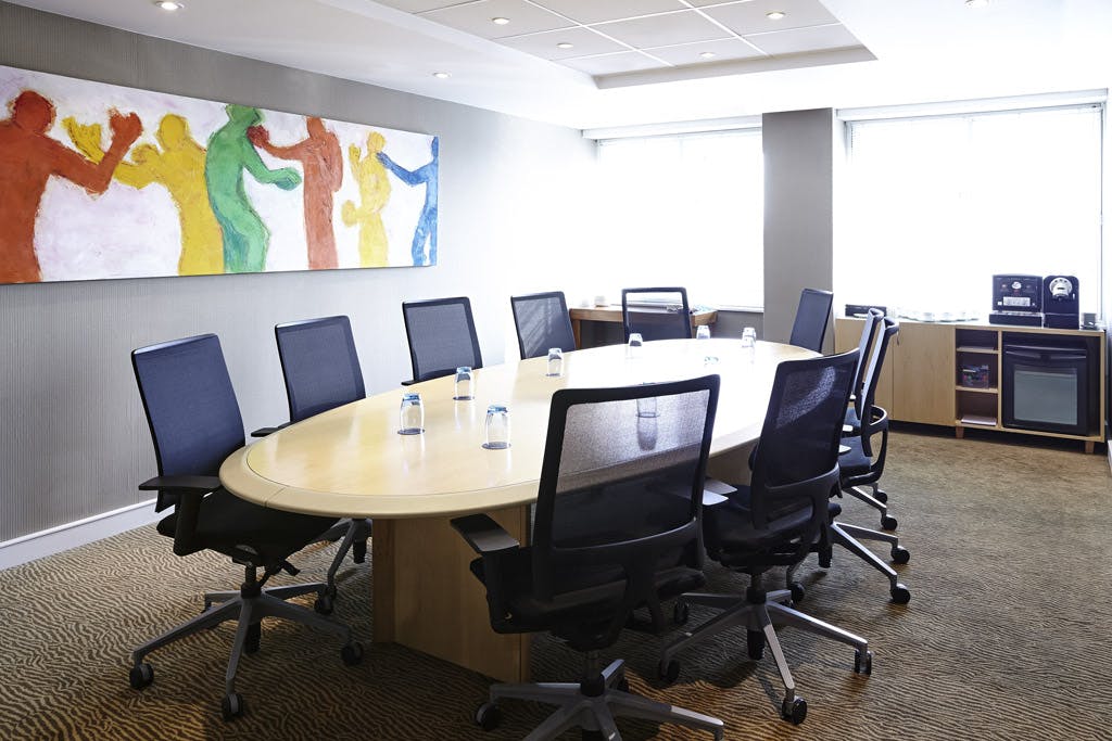 Modern Executive Boardroom at Novotel London West, oval table, ideal for meetings and events.