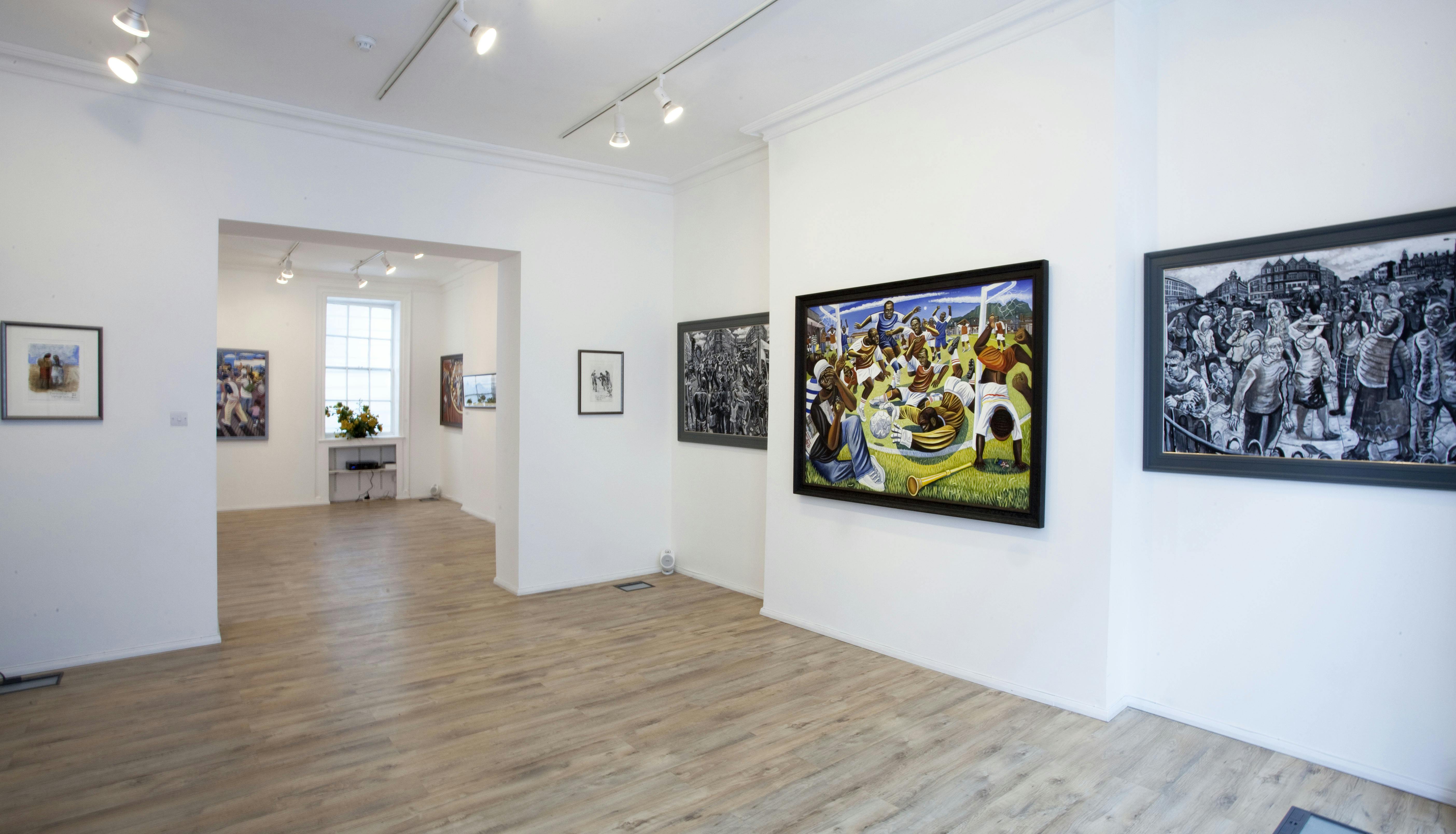 Spacious modern gallery with artworks, perfect for art exhibitions and networking events.