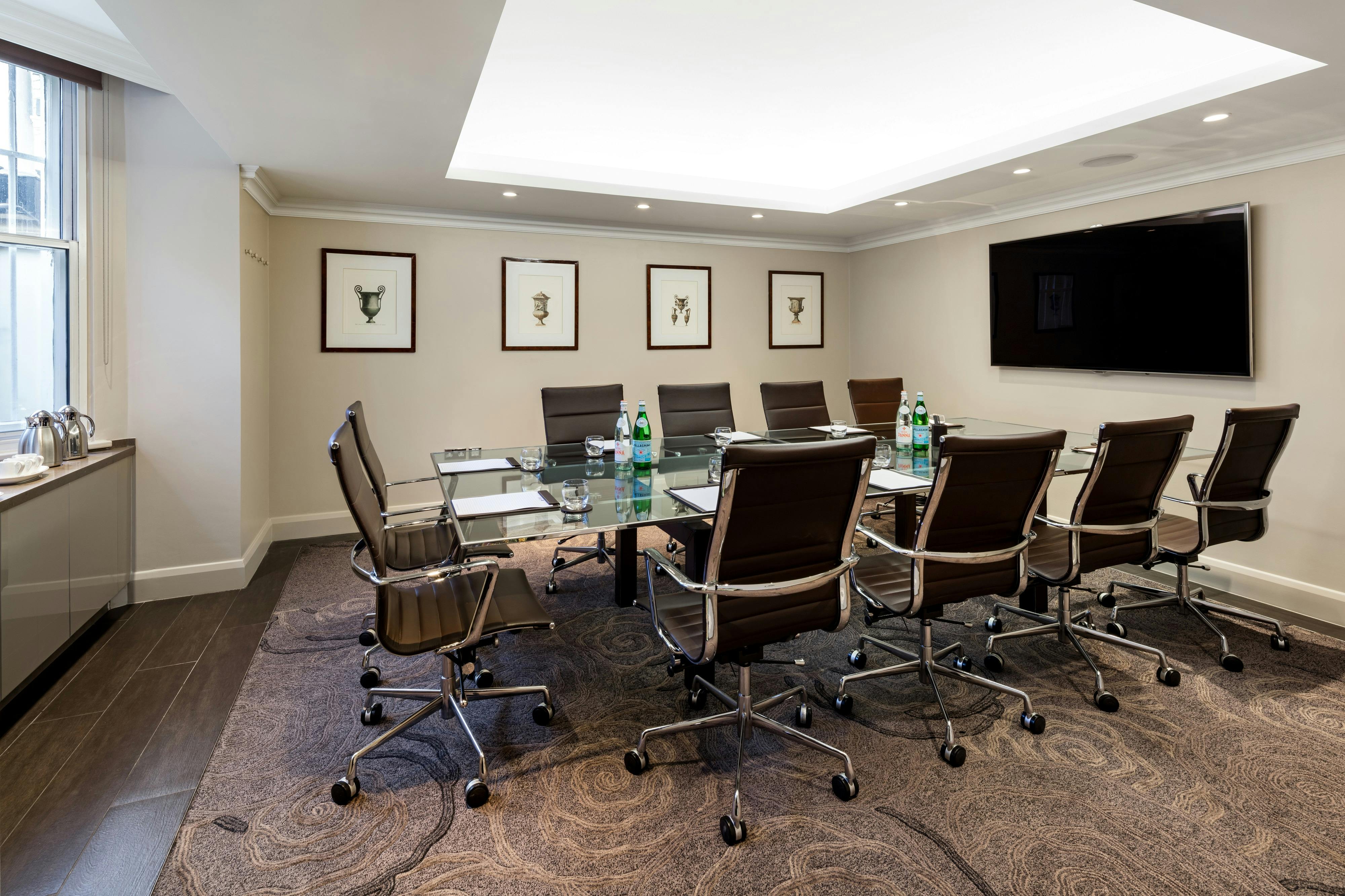 Modern meeting room with glass table at Radisson Blu Hotel, London South Kensington.