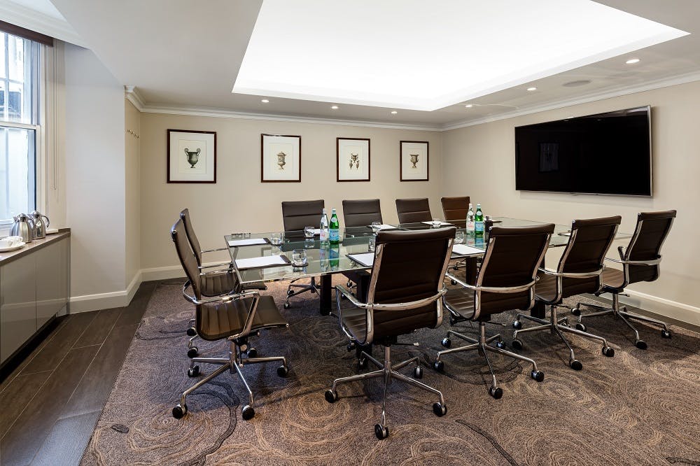 Modern conference room with glass table at Radisson Blu Hotel, London South Kensington.