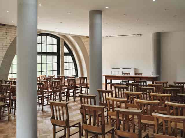 Ollerton Room at The Pumping House: bright meeting room with arched windows for seminars.