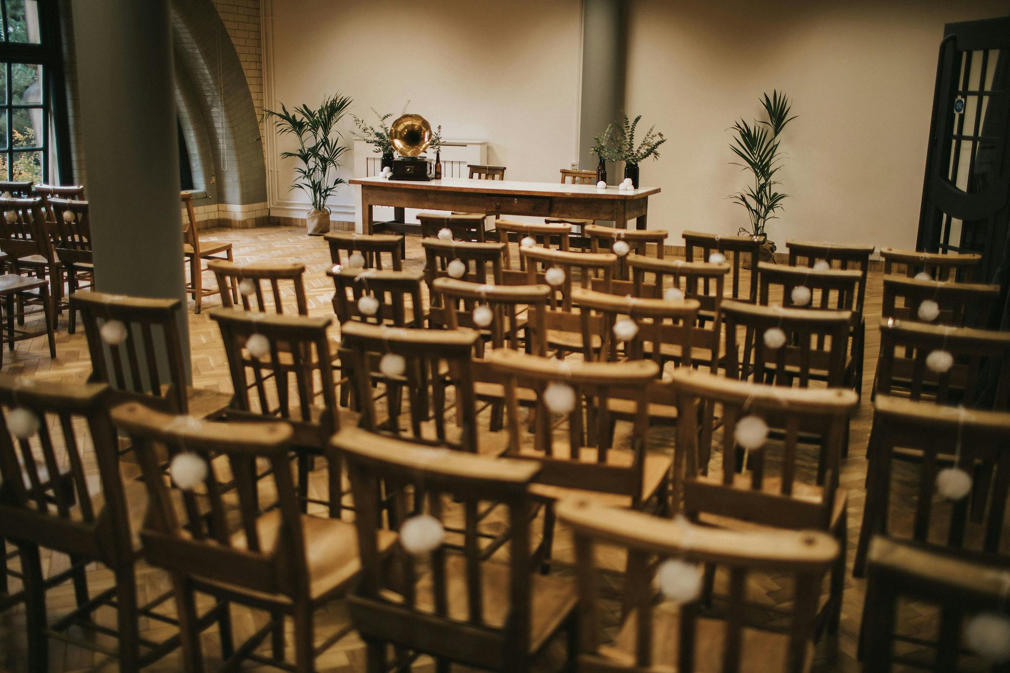 Ollerton Room event space with wooden chairs, ideal for workshops and gatherings.