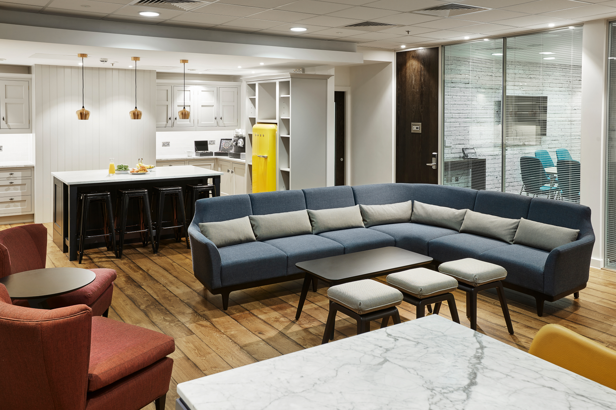 Modern meeting space with sectional sofa in Marlin Waterloo for networking events. - Banner