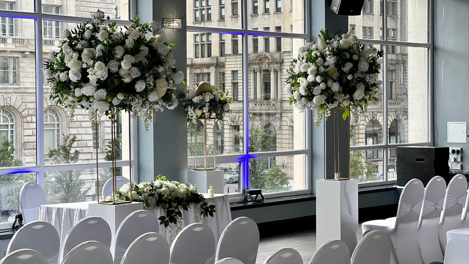 Cunard Suite at The Bentley, elegant wedding venue with floral centerpieces and city views.