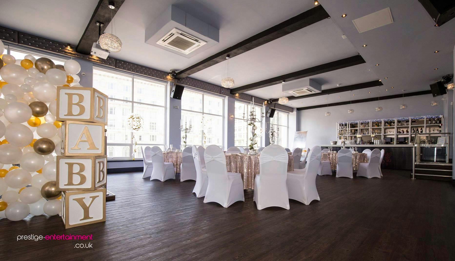 Cunard Suite at The Bentley, elegant white and gold decor for baby showers.