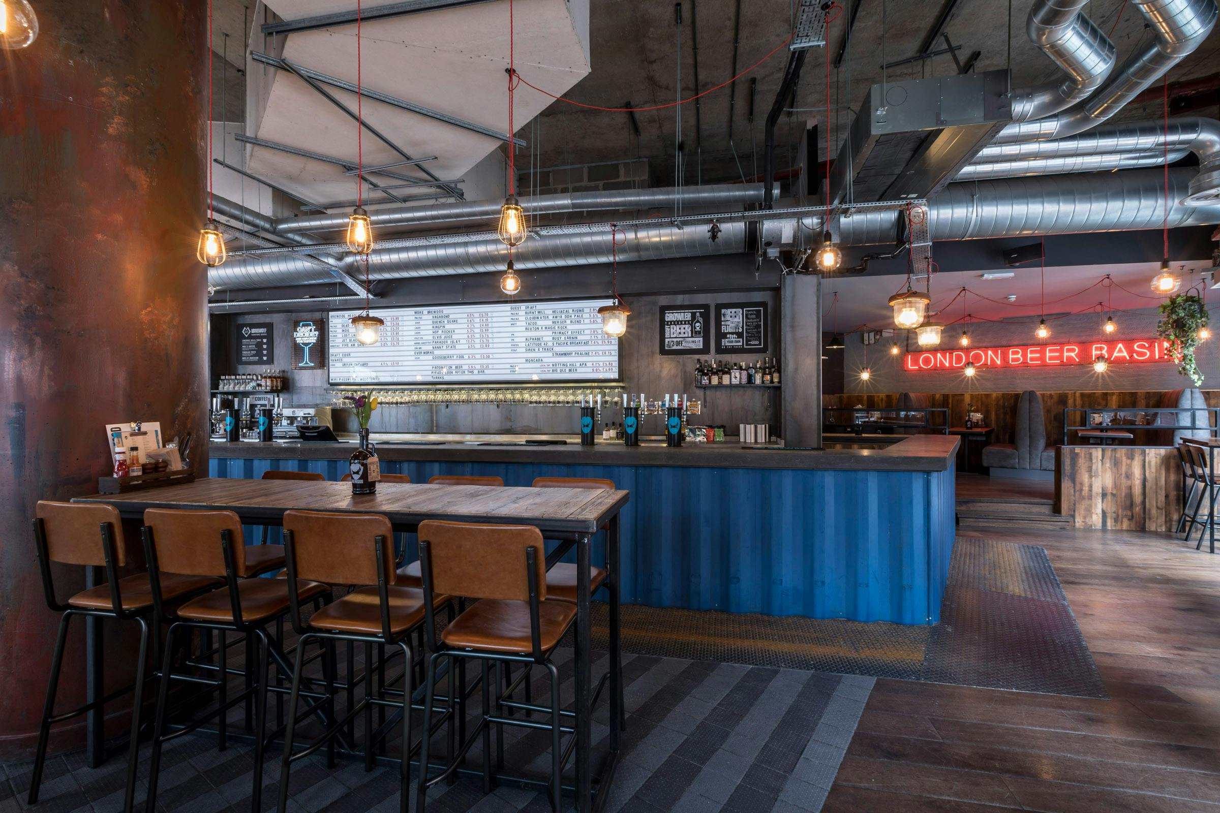 Modern bar venue with industrial design, perfect for casual networking events.