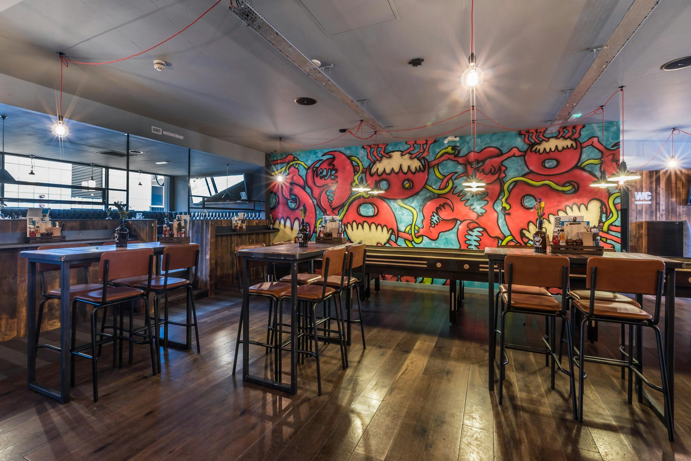 Vibrant BrewDog Paddington venue with colorful mural, ideal for networking events.